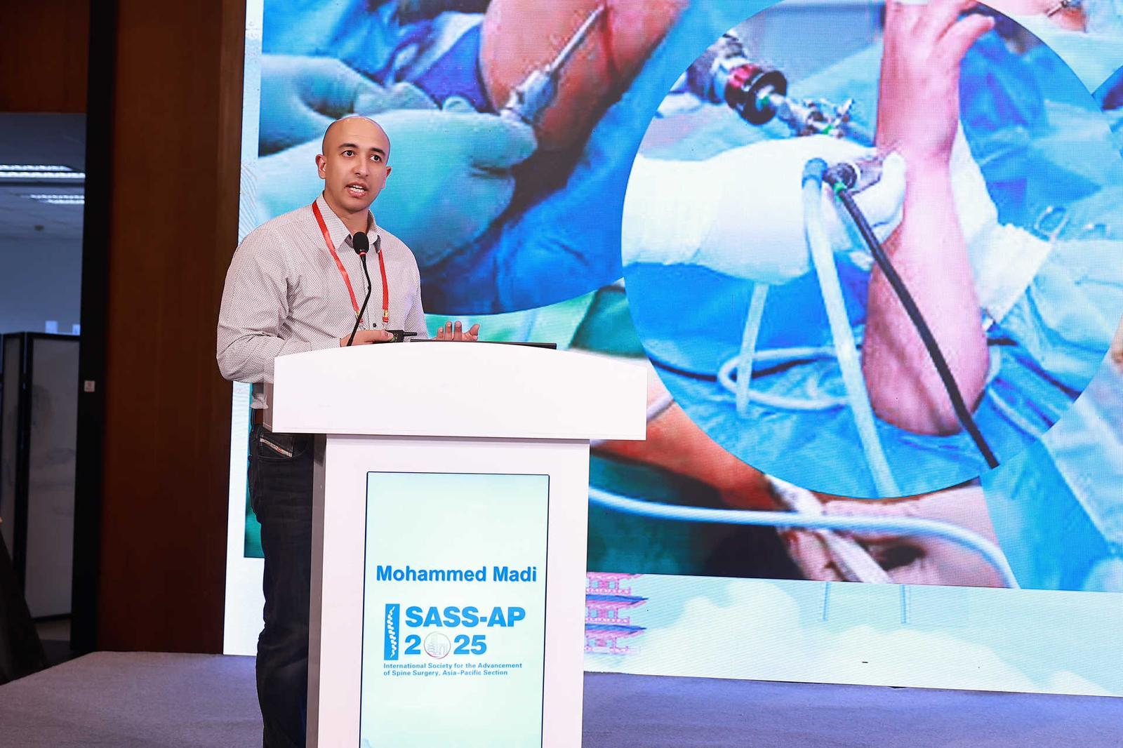 Mr Madi presenting at SASS-AP 2025, the International Society for the Advancement of Spine Surgery, Asia–Pacific Section